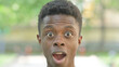 © stockbakers - Close-up of a Excited Young African Man Surprised Face