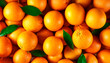 © Lissa - A background of bright and juicy oranges with a top view, filling the entire screen. High quality photo