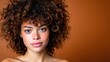 © Freshpixel - A captivating portrait of a young woman with luscious curly hair and a radiant smile, set against a warm-toned background that enhances her natural beauty and charm.