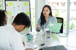 © itchaznong - ESG and Sustainability Discussion. Team collaborating on environmental strategies in a modern workspace.