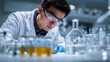 © At My Hat - Scientist in lab coat analyzing research under sterile conditions with lab equipment. Great visual for medicine, vaccine, or laboratory themed presentations.