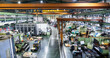 © metamorworks - Aerial view of the inside of a factory with rows of machine tools