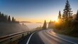 © Kerry - misty mountain road at sunrise with pine trees and guardrail foggy forest landscape scenic nature view for travel adventure and outdoor concept peaceful morning atmosphere
