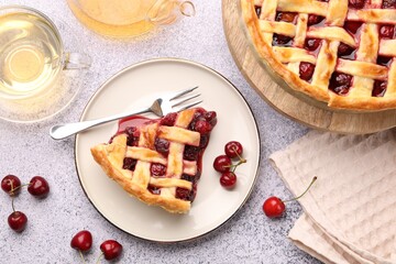Wall Mural - tasty cherry pie, berries and tea on grey textured table, flat lay