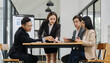 © Wicitr - Teamwork Meeting: Business team collaborating on a project, showing engagement and focus in a modern office setting.