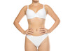 © vladimirfloyd - Studio shot of woman in white underwear, front view, studio lighting on white background
