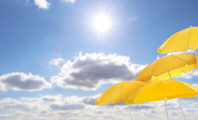 Wall Mural - yellow beach umbrellas against blue sky on sunny day