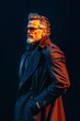 © Oleksandr Pashchenko - A man in a black coat and sunglasses standing in front of a black background