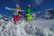 © Sergey Novikov - Joyful snow day with kids and teenager leaping energetically