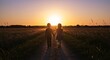© Marco Mamdouh - Silhouetted Kids Siblings Holding Hands on a Rural Path at Sunset