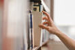 © Smallroombigdream - right hand choosing and picking book in public library.