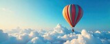 A whimsical hot air balloon floats serenely against a vibrant blue sky, casting a long shadow on the fluffy clouds below Perfect for travel, adventure, and freedom concepts , cloudscape, day