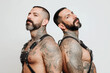 © alexkoral - couple of gay adult men in leather harness on white background