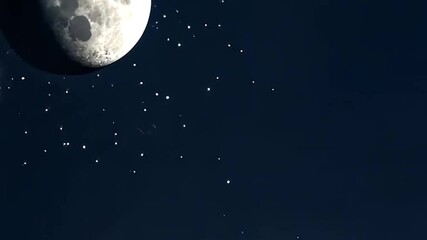 Wall Mural - moon illuminated with stars in a dark blue night sky. cinematic shot of moon in space with shining s