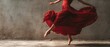 © MP Studio - The dancer in a flowing red dress captures motion and grace.