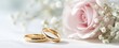 © Studio Nova - The elegant gold wedding rings beside a beautiful pink rose