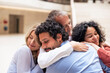 © Westend61 - Multiracial businessmen and businesswomen embracing in lobby