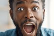© nisi - Close up photo happy surprised excited face miracle good news amazing rejoice saying wow African American ethnic man open mouth wide surprise male at home insurance loan owner achieve success