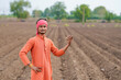 © PRASANNAPIX - young indian farmer standing at agricultural field
