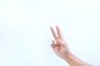 © Aditiya - Peace gesture using fingers. Peace symbol