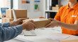 © ZiletterId - Female Customer Handing Over a Parcel to a Courier at a Shipping Counter