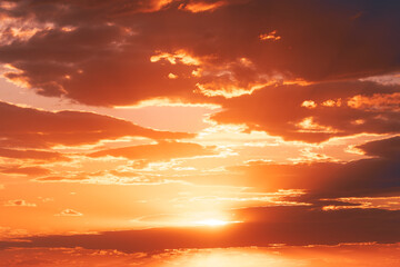 Wall Mural - Amazing Bold Golden Sunset Sunrise Sky Background. Natural Bright Orange Dramatic Sky In Sunset Dawn Sunrise. Warm Yellow And Orange Colors