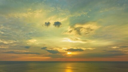 Wall Mural - aerial hyperlapse view of beautiful light through in golden sky at sunset. gradient color. sky textu