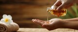 The soothing moment of oil being poured into hands for relaxation.