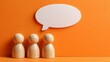 © Lightning - Wooden peg dolls standing with a white speech bubble on an orange background representing communication