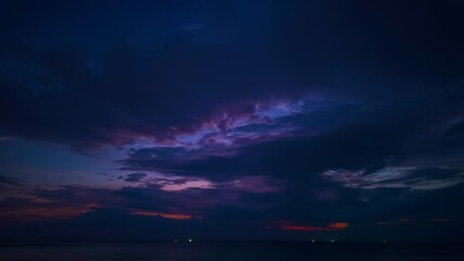 Wall Mural - time lapse sky cloudscape with colorful clouds at sunset above the sandy beach dramatic sky with col
