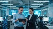© VECTOR_AKAS - Diverse team collaborates on a tablet in a modern data center control room