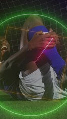 Wall Mural - animation of neon shapes over african american male soccer player