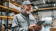 © Generative AI - Elderly Man Smiling While Using Tablet in Warehouse with Shelves and Storage Area.
