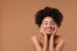 © New Africa - Portrait of beautiful Brazilian woman after spa treatment on light brown background. Space for text