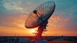 © Endang - Large satellite dish at sunset