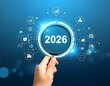 © Yusuf - The year 2026 on the year scale in the focus of a magnifying glass Upcoming trends Financial forecasting Strategic vision Global events in the near future