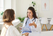 © Studio Romantic - Young nurse, smiling female doctor consulting woman patient at appointment in clinic, explaining medical checkup results, giving recommendations at meeting, talking about exam result, helping, support