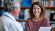 © Maksym - Warm scene of physician providing health advice, patient seated comfortably opposite, doctor smiling gently while delivering empathetic support, clinic consultation room filled wit