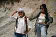 © saltdium - Two Active mature women exploring a rocky trail, sharing friendship and an energetic lifestyle in nature