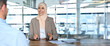 © Stock 4 You - Businesswoman in hijab making financial consultation for client in office. Professional business people muslim woman and man working together as team at desk. Over shoulder view. Banner, copy space