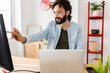 © Xavier Lorenzo - Happy professional business man working on laptop at home office. Teleworking and entrepreneur people concept.