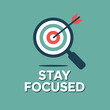 © Ultimate - Stay Focused Motivational Graphic with Target and Magnifying Glass graphic featuring target arrow viewed through magnifying glass the text STAY FOCUSED Aimed promoting concentration achieving