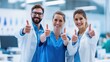 © Ali - The healthcare team celebrating success with thumbs-up in a modern clinic setting.