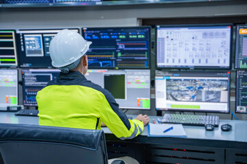 Engineer working at control room, Manager control system, Technician man monitoring program from a lot of monitor.
Specialist observes analytics dashboard,operator inspects digital interface