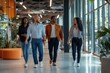© Ifti Digital - Group of diverse colleagues walking together in a modern office space during the day, Medium shot of four multi ethnic male and female colleagues walking