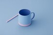 © Nu - Empty light blue mug with pink accents on a pastel blue background