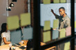 © Maskot - Businessman explaining diagram to team attending meeting in conference room at office