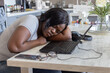© Anna Berkut/Stocksy - burnout, tired woman student sleeping near computer laptop