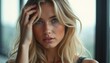 © natakot - Captivating portrait of a young woman with flowing blonde hair