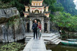 © Studio KME/Stocksy - Couple Standing in Front of Historic Pagoda in Ninh Binh